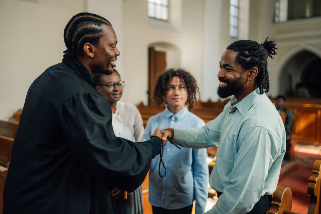 community leader greeting residents in a local church